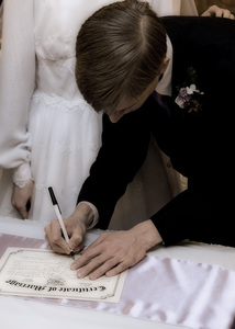 Daniel signing the marriage certificate.